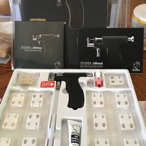 Ear piercing kit. Lots of extras included.